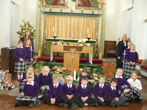 Pictured in Chapel are Sharon Owen, Head of Lower School, Shan Morgan, Deputy Head of Lower School and Lower School pupils. 